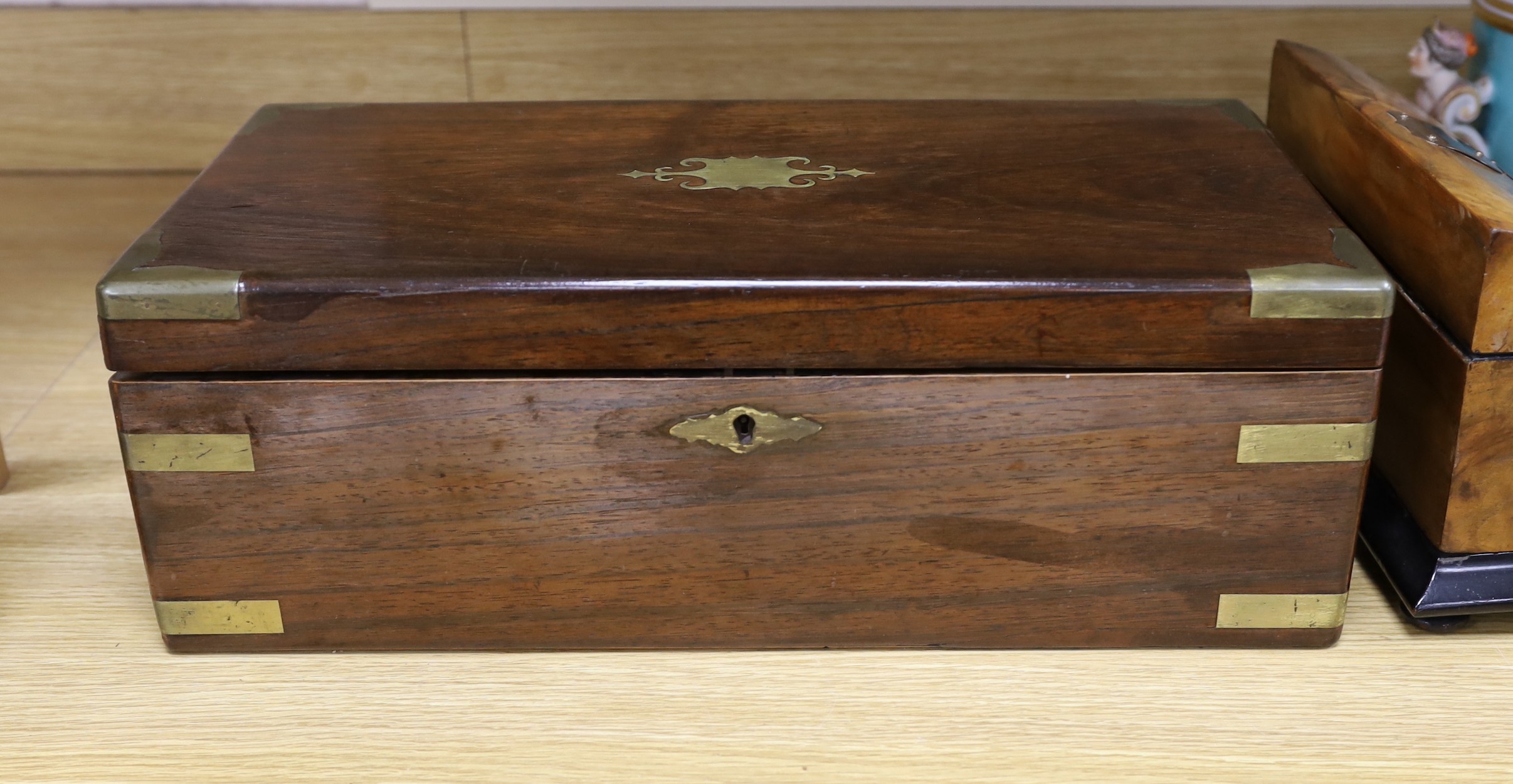 A Victorian brass bound rosewood writing slope and a Victorian walnut inkstand stationery rack, largest 50cm wide